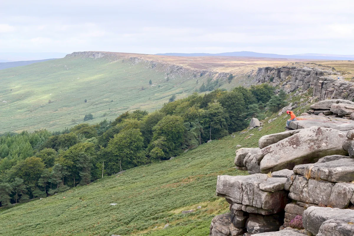 Climber on Stanage Edge gritstone near Hathersage